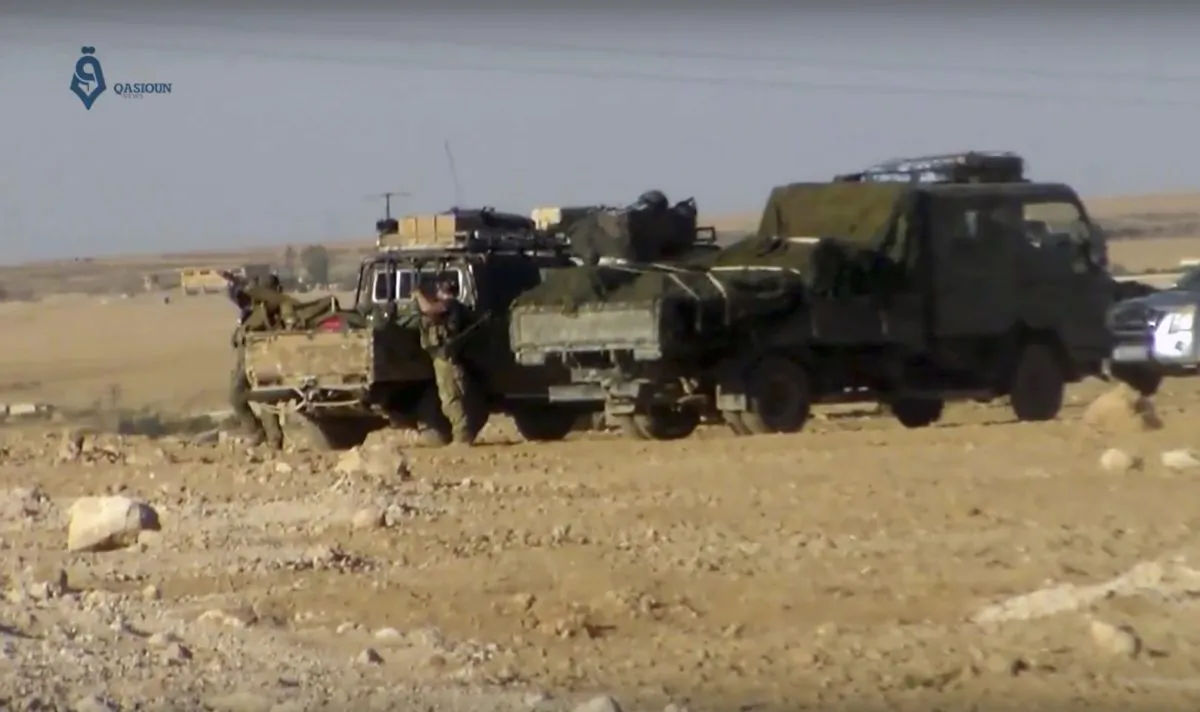 This frame grab from a video provided by Qasioun a Syrian opposition media outlet, shows U.S.-backed Syrian Democratic Forces fighters stationed near Ein Issa, north of Raqqa, Syria. Backed by U.S. airstrikes, Kurdish-led Syrian fighters clashed on Monday with Islamic State militants north of the city of Raqqa in Syria as they pushed ahead in their offensive aiming to liberate the city that has been the de facto capital of the extremist group since 2014. (Qasioun a Syrian Opposition Media Outlet, via AP)