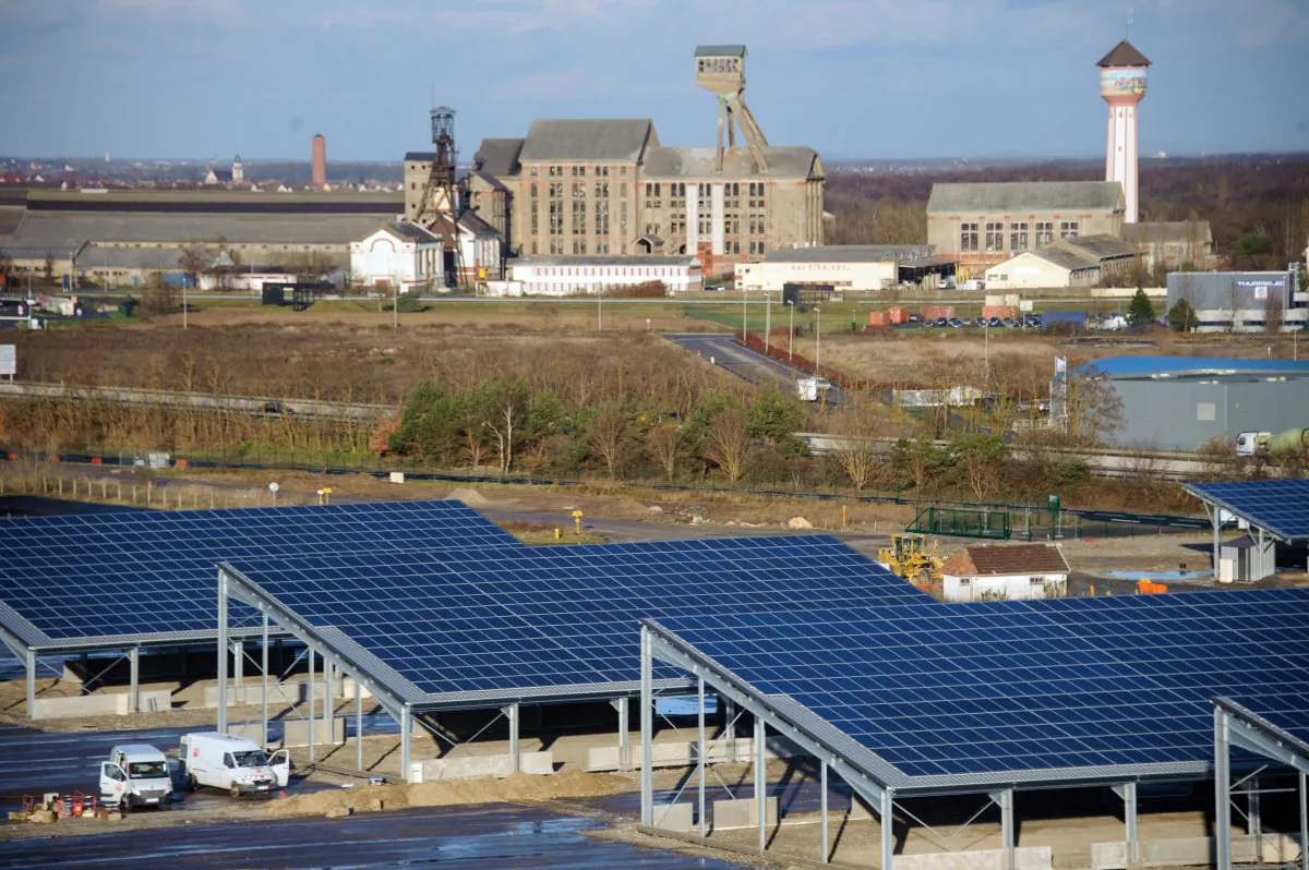 A solar plant in front of a potash mine in Ungersheim, France, on Dec. 6. Investment in companies that operate in sustainable ways is on the rise. (SEBASTIEN BOZON/AFP/Getty Images)
