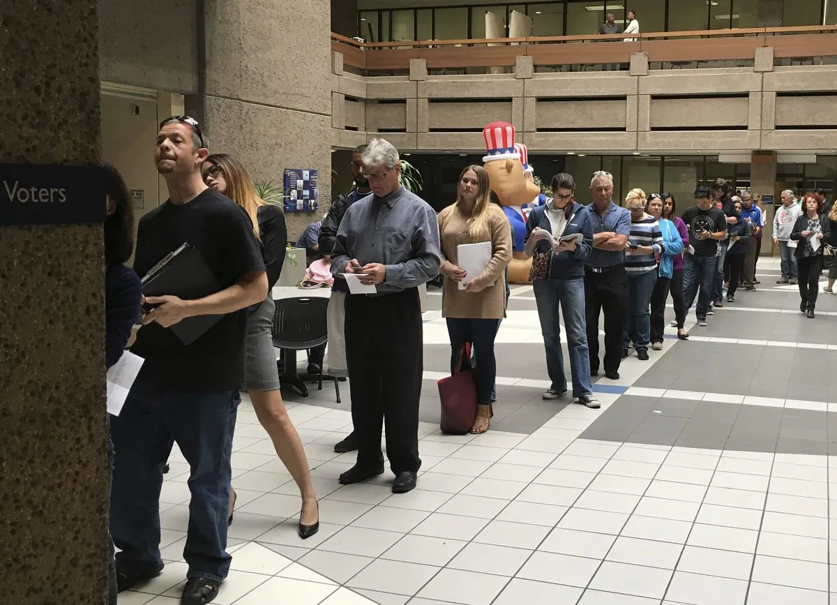 The line of voters waiting to cast an early ballot at the Santa Clara County Registrar of Voters' office winds into the building's atrium in San Jose, Calif., on Nov. 7, 2016. (Ramman Kenoun/Santa Clara Country Registrar of Voters via AP)