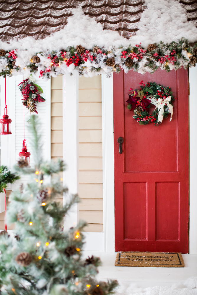One way to jazz up the entryway is to hang a wreath on the door. (aprilante/Shutterstock)