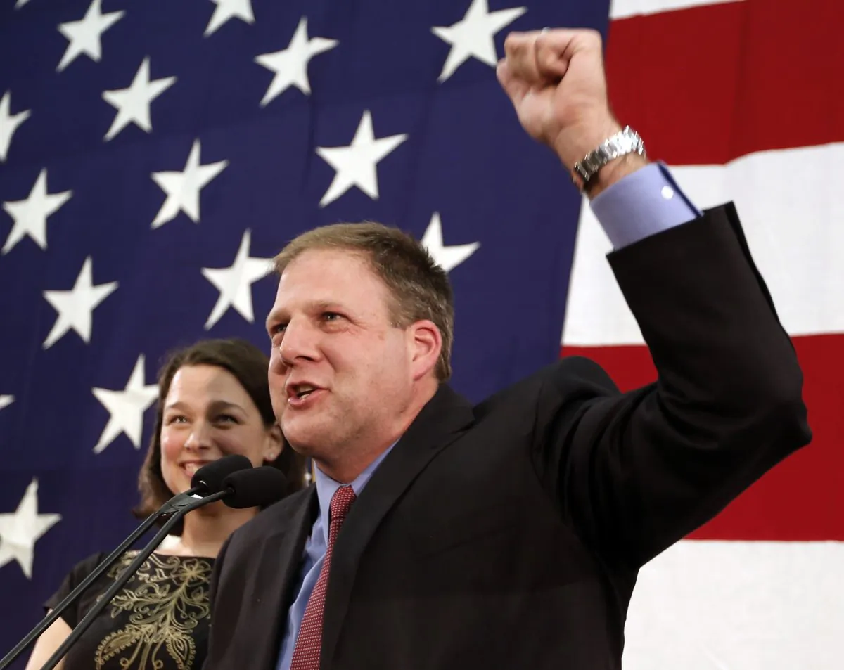 Gov. Chris Sununu rallies supporters early in the morning  Nov. 9, 2016, in Concord, N.H.  (AP Photo/Jim Cole)