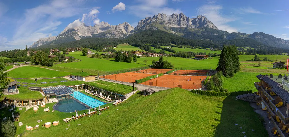 Part of the grounds at Stanglwirt Bio and Wellness Hotel, with the local village and the Wilder Kaiser Mountains in the background. (Stanglwirt Bio and Wellness Hotel)
