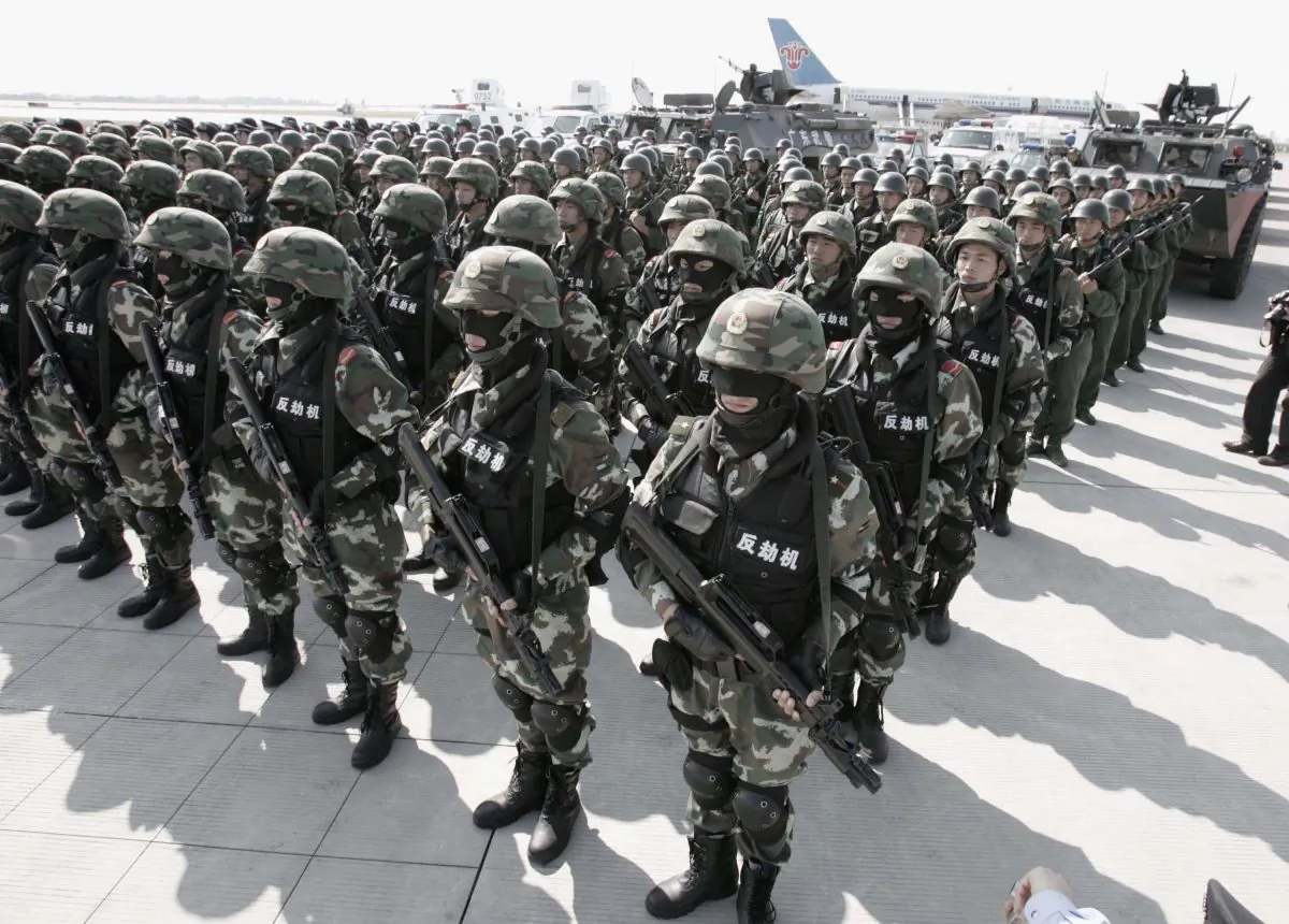 Troops from the People's Armed Police form up for an anti-hijack drill in Guangzhou City, China on Nov. 16, 2005. (China Photo/Getty Images)