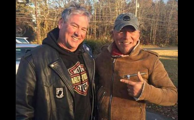 In this Friday, Nov. 11, 2016, photo provided by Ryan Bailey, Dan Barkalow, left, and Bruce Springsteen poses for a photo in Wall Township, N.J. Barkalow and a group from the Freehold American Legion was riding after a Veterans Day event Friday when they pulled over to help a stranded motorcyclist who turned out to be The Boss. (Ryan Bailey via AP)