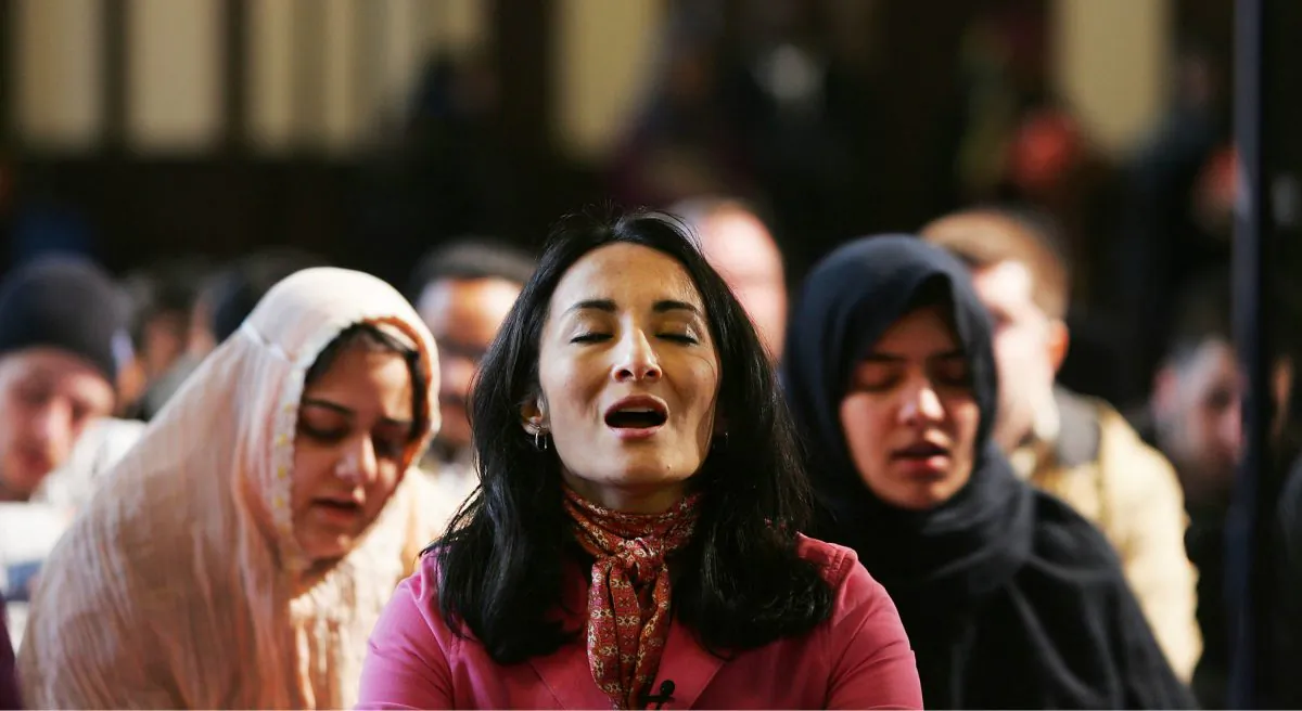 Feminist Muslim author Asra Nomani (C) prays with other women during a rare public mixed gender, woman-led prayer service in New York City in this 2005 file photo. The controversial expression of Muslim women's rights drew quick criticism from Muslim religious leaders in the Middle East, according to published reports. (Chris Hondros/Getty Images)