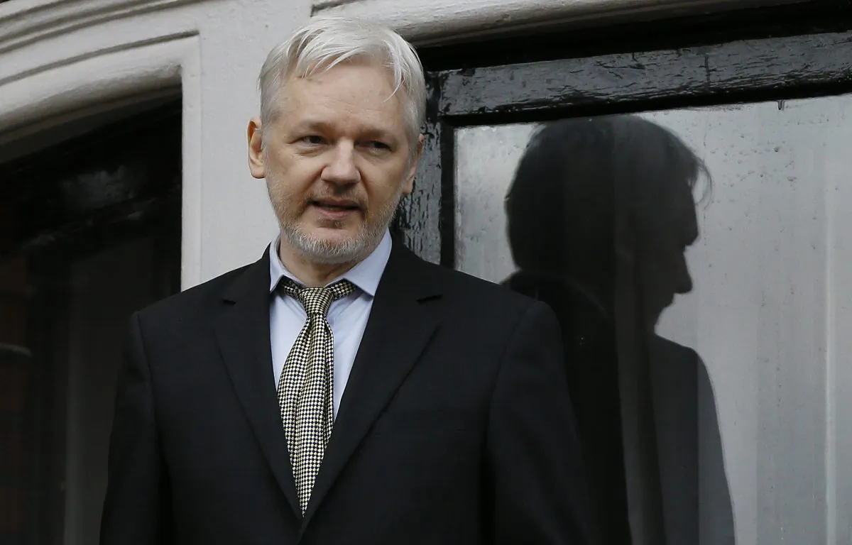 WikiLeaks founder Julian Assange speaks from the balcony of the Ecuadorean Embassy in London, in this file photo. (Kirsty Wigglesworth/AP)