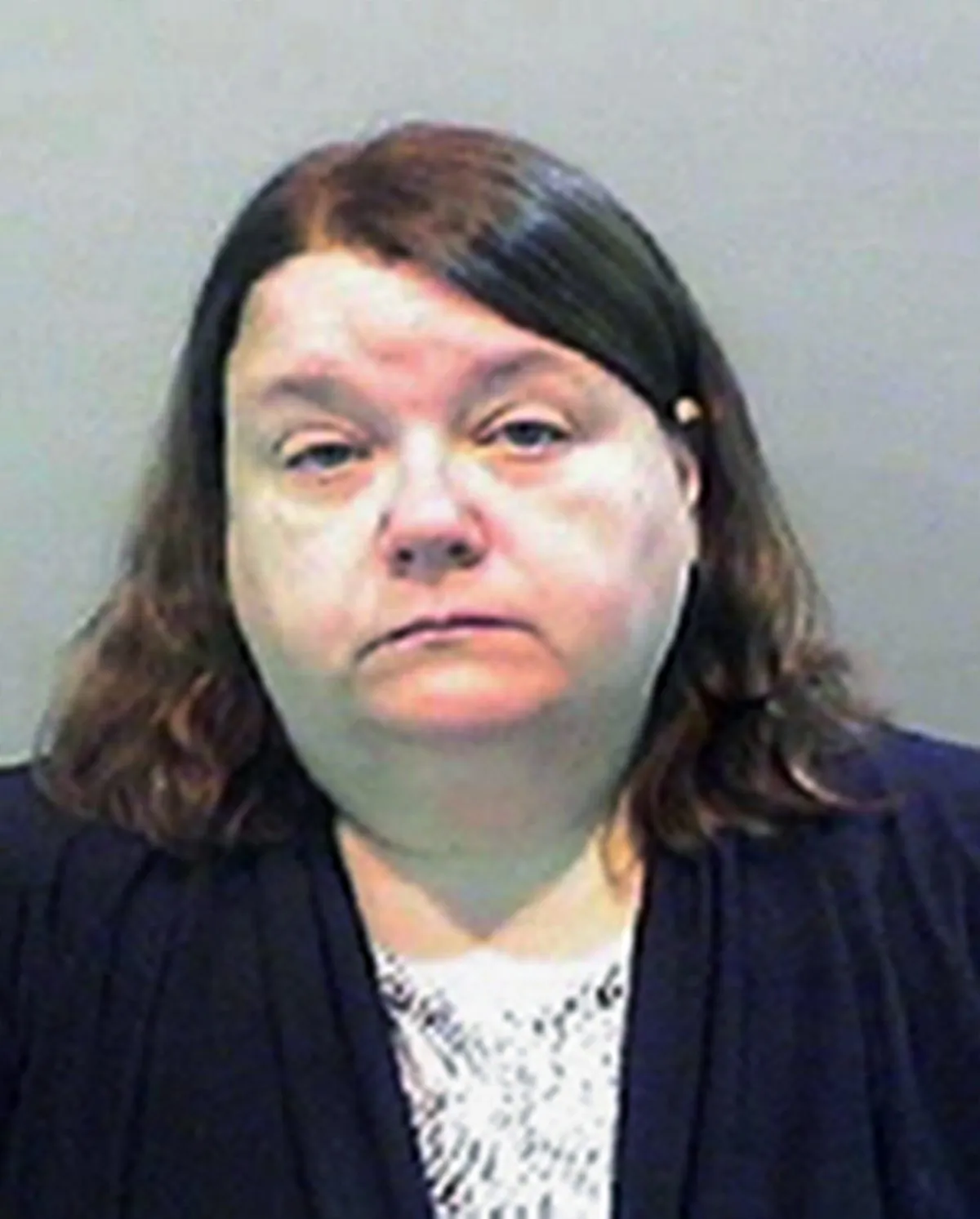 This undated photo provided by the Detroit Police Department shows Kelly Williams, a Child Protective Services employee, whom is one of two women charged Monday, Nov. 14, 2016, with manslaughter and child abuse in the death of a 3-year-old Detroit boy. (Detroit Police Department via AP)