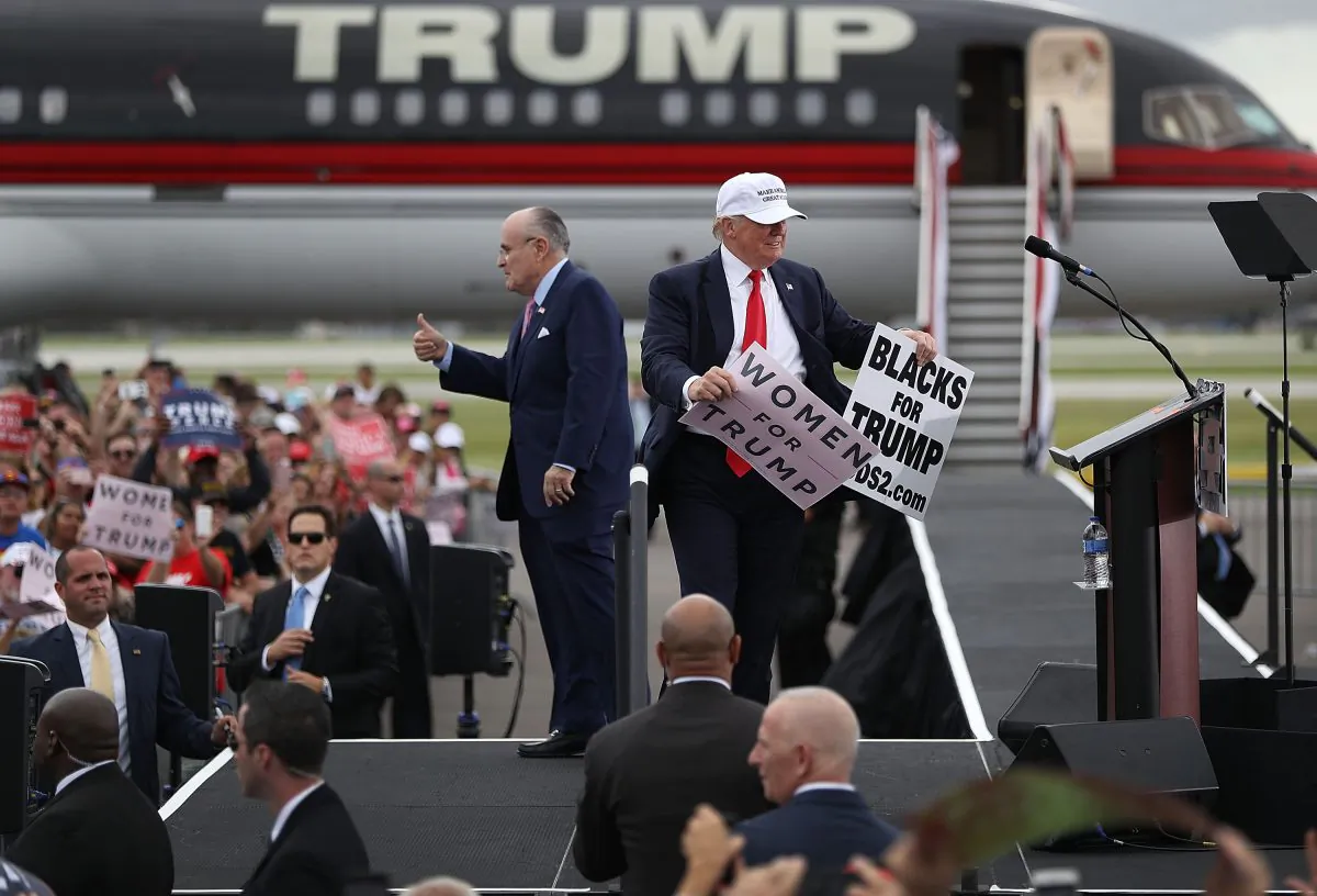 Republican presidential candidate Donald Trump and former New York City mayor Rudy Giuliani campaign together during a rally at the Lakeland Linder Regional Airport on Oct. 12, 2016 in Lakeland, Florida. (Joe Raedle/Getty Images)