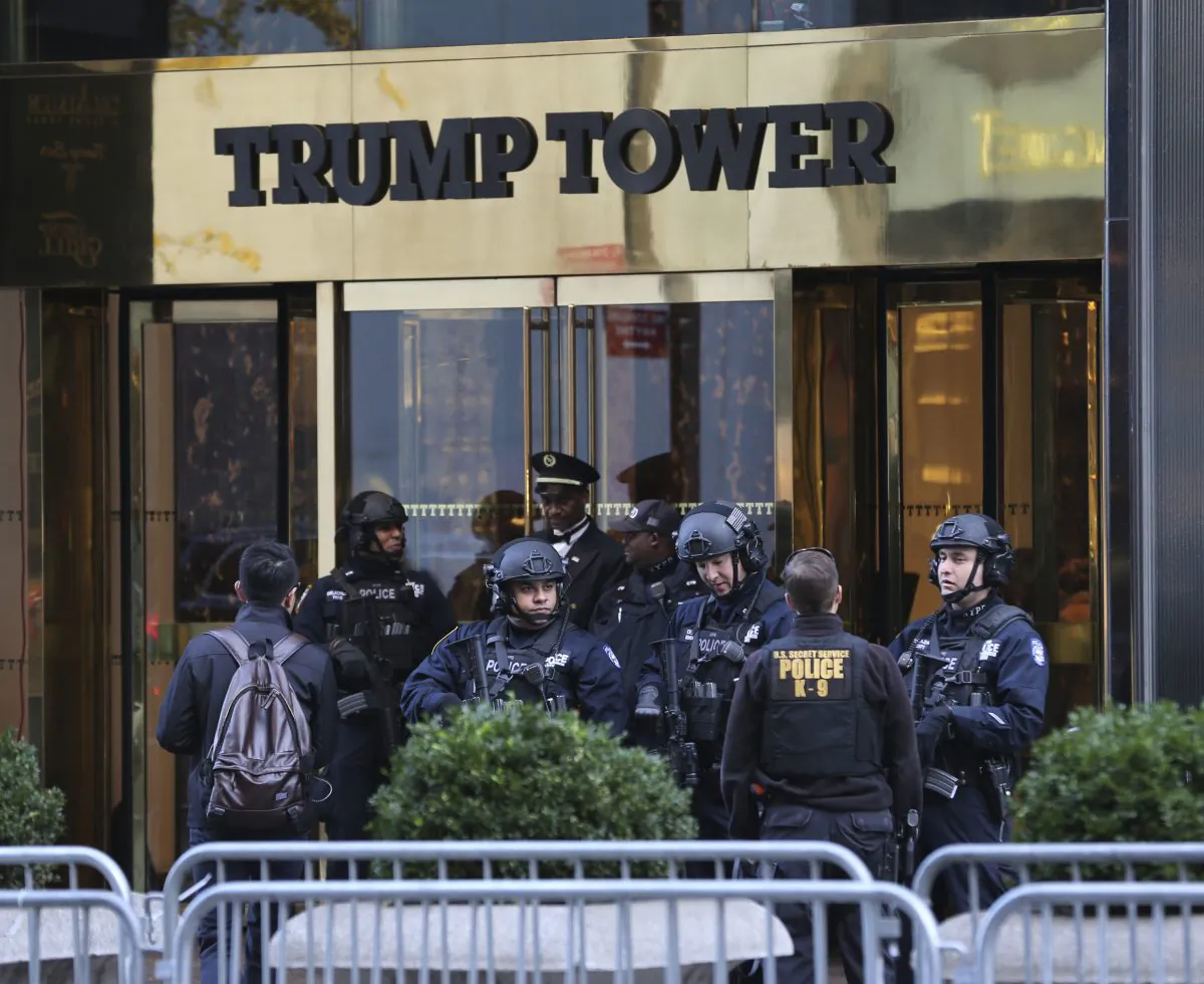 Security personnel stand at the front entrance of Trump Tower in New York, Thursday, Nov. 17, 2016. (AP Photo/Seth Wenig)