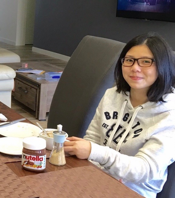 Rabee enjoying a Western style snack, in Brisbane, during August 2016. (Linda Huang/NTD Television)