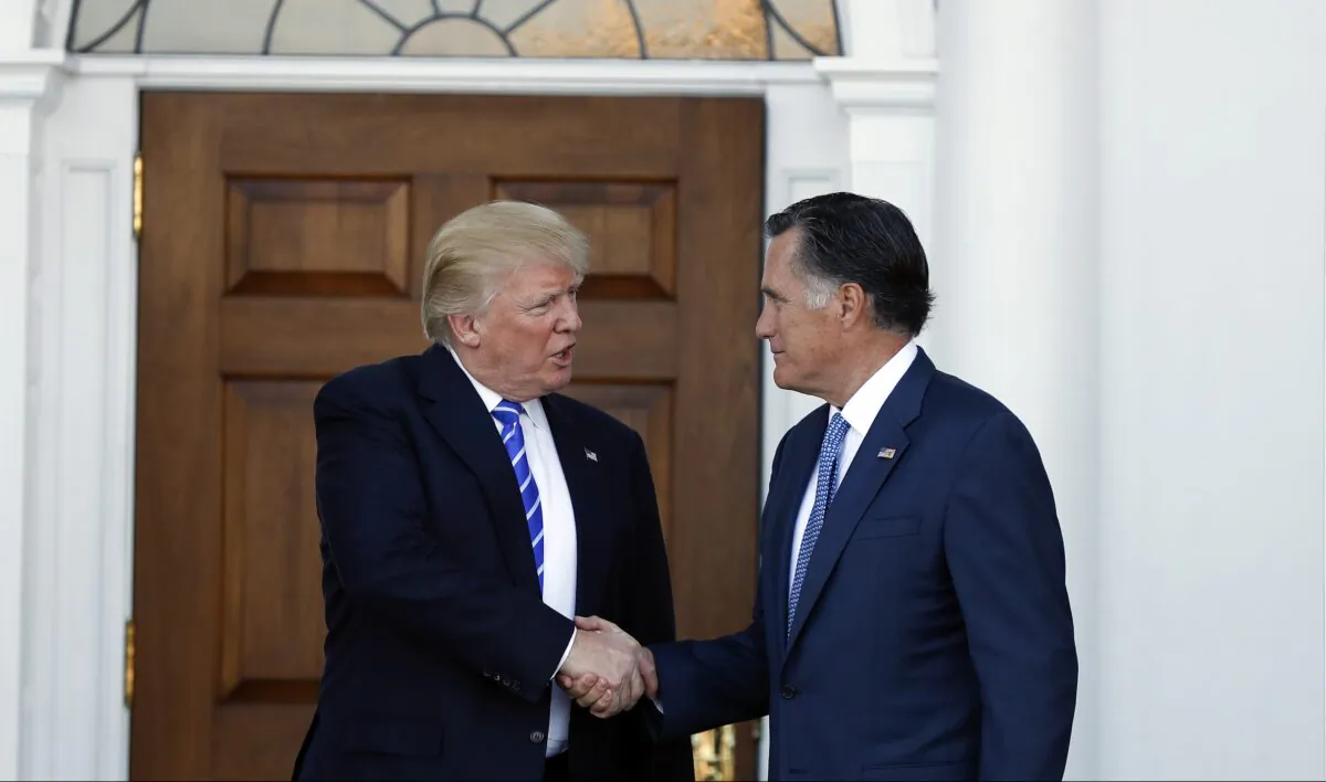 Then-President-elect Donald Trump and Mitt Romney shake hands as Romney leaves Trump National Golf Club Bedminster in Bedminster, N.J., on Nov. 19, 2016. (AP Photo/Carolyn Kaster)
