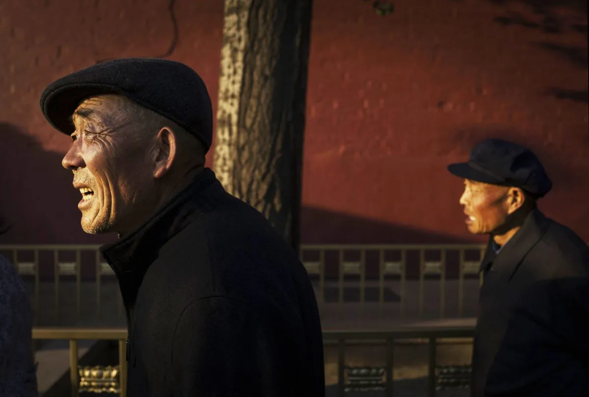 Chinese retirees walk on the street in Beijing Oct. 16, 2014. (Kevin Frayer/Getty Images)