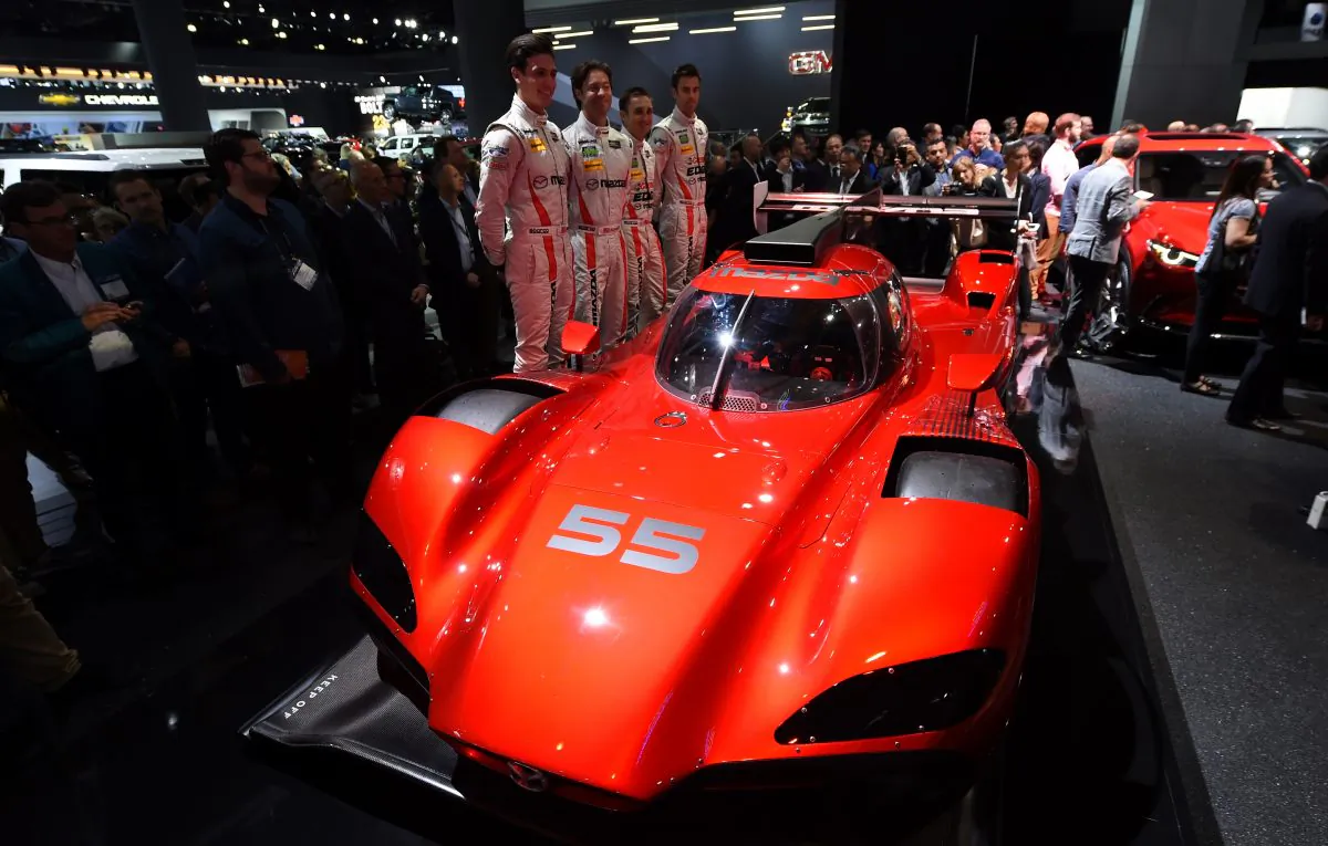 Drivers Tristan Nunez, Jonathan Bomarito, Tom Long and Joel Miller unveil the Mazda RT24-P DPi racing car at the Mazda press conference at the Los Angeles Auto Show, in Los Angeles, California, November 16, 2016. (Robyn Beck/AFP/Getty Images)The LA Auto Show is open to the public from November 18 through November 27. / AFP / Robyn Beck (Photo credit should read ROBYN BECK/AFP/Getty Images)
