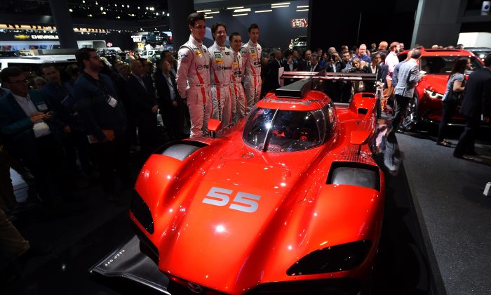 Drivers Tristan Nunez, Jonathan Bomarito, Tom Long and Joel Miller unveil the Mazda RT24-P DPi  racing car at the Mazda press conference at the Los Angeles Auto Show, in Los Angeles, California, November 16, 2016. (Robyn Beck/AFP/Getty Images)The LA Auto Show is open to the public from November 18 through November 27. / AFP / Robyn Beck        (Photo credit should read ROBYN BECK/AFP/Getty Images)
