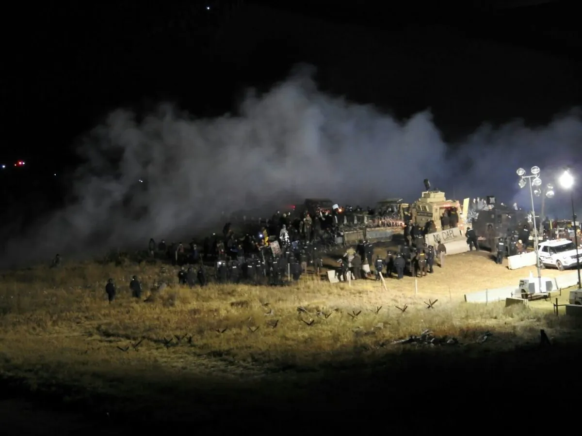 In this image provided by Morton County Sheriff’s Department, law enforcement and protesters clash near the site of the Dakota Access pipeline on Sunday, Nov. 20, 2016, in Cannon Ball, N.D.  (Morton County Sheriff’s Department via AP)