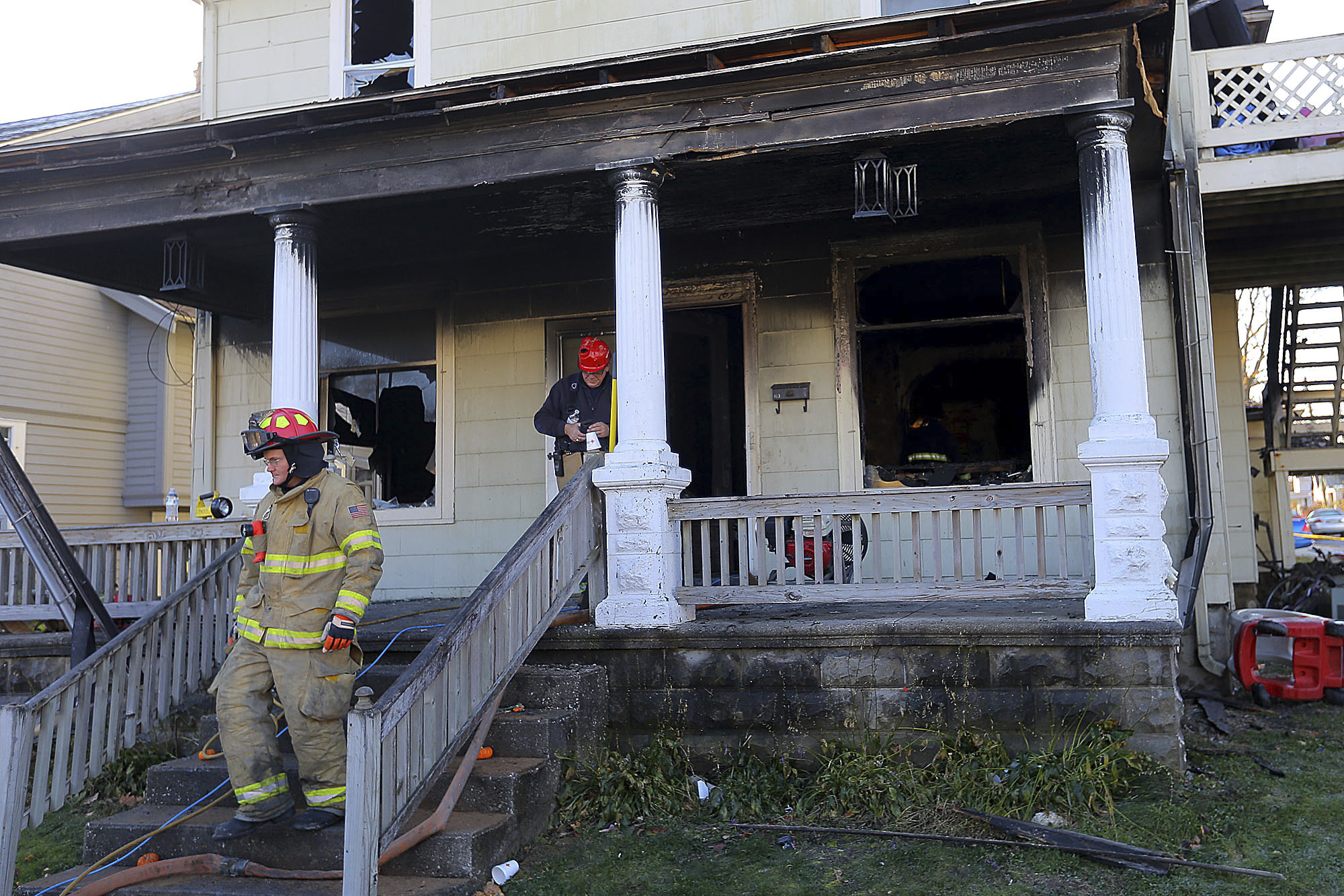 Firefighters work at a house where four children died in a house fire in the 100 block of East Columbia Street in Flora, Ind., on Nov. 21, 2016. (Tim Bath/Kokomo Tribune via AP)
