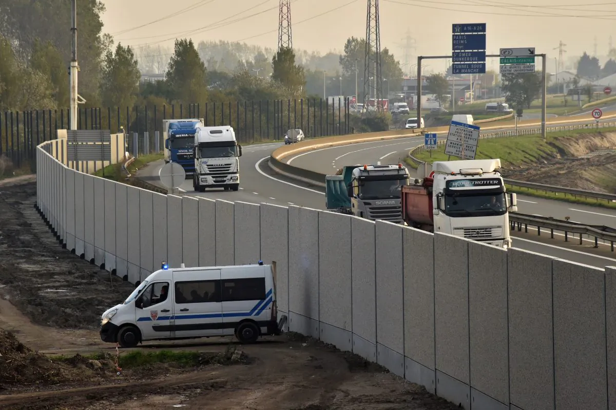 A police vehicle next to a concrete 4-metre-high wall in Calais, northern France on October 26, 2016. (PHILIPPE HUGUEN/AFP/Getty Images)