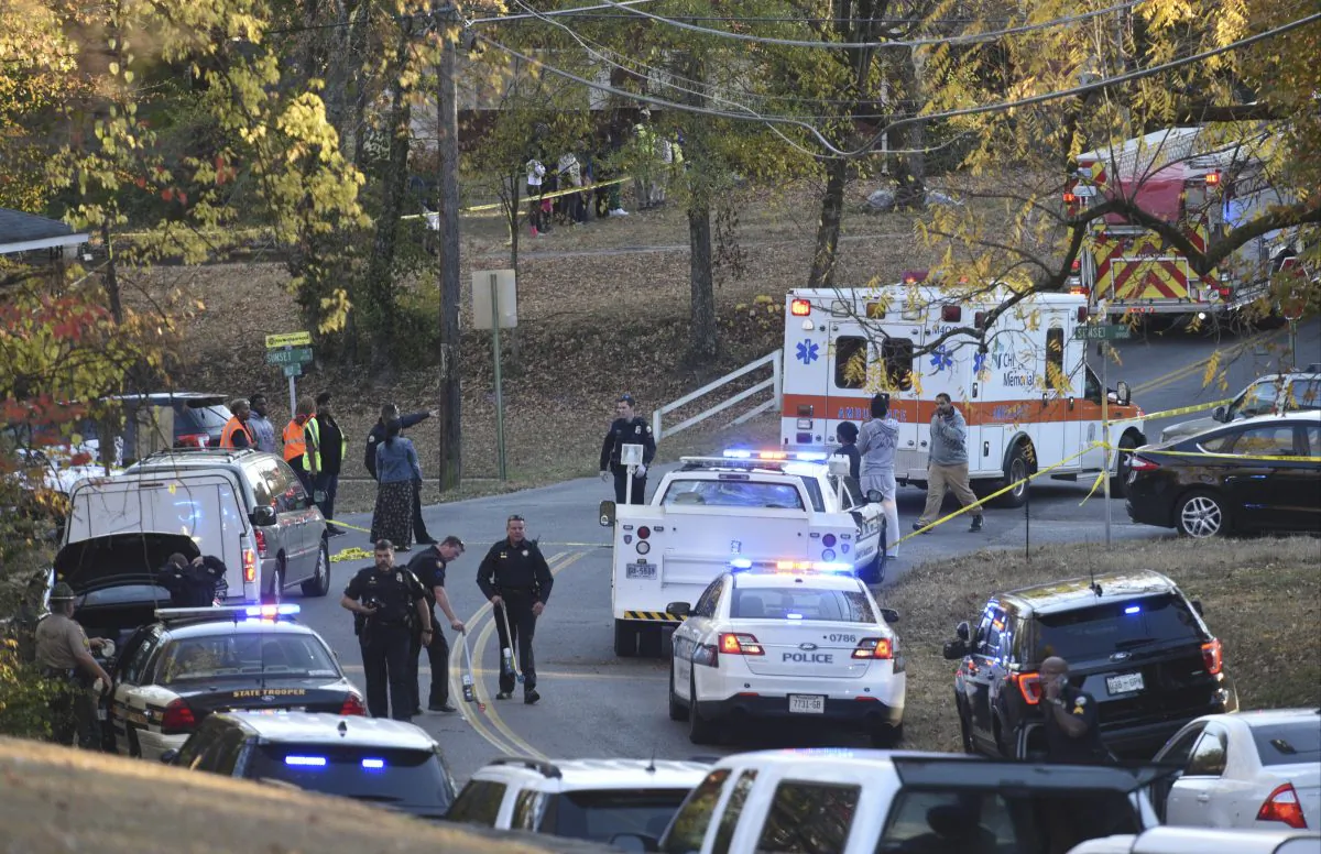 Emergency personnel work at the scene of a fatal school bus wreck in Chattanooga, Tenn., Monday, Nov. 21, 2016. In a news conference Monday, Assistant Chief Tracy Arnold said there were multiple fatalities. (Angela Lewis Foster/Chattanooga Times Free Press via AP)