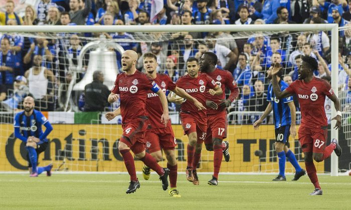 Toronto FC's Michael Bradley celebrates after scoring his side’s second goal against the Montreal Impact in the first leg of the MLS Eastern Conference final in front of 61,004 fans at the Olympic Stadium in Montreal on Nov. 22, 2016. (The Canadian Press/Graham Hughes)
