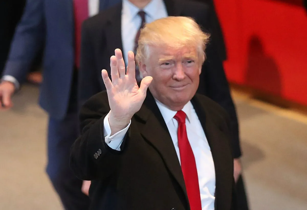 NEW YORK, NY - NOVEMBER 22:  President-elect Donald Trump walks through the lobby of the New York Times following a meeting with editors at the paper on November 22, 2016 in New York City. Trump, who has held meetings with media executives over the last few days, has often had a tense relationship with many mainstream media outlets.  (Photo by Spencer Platt/Getty Images)