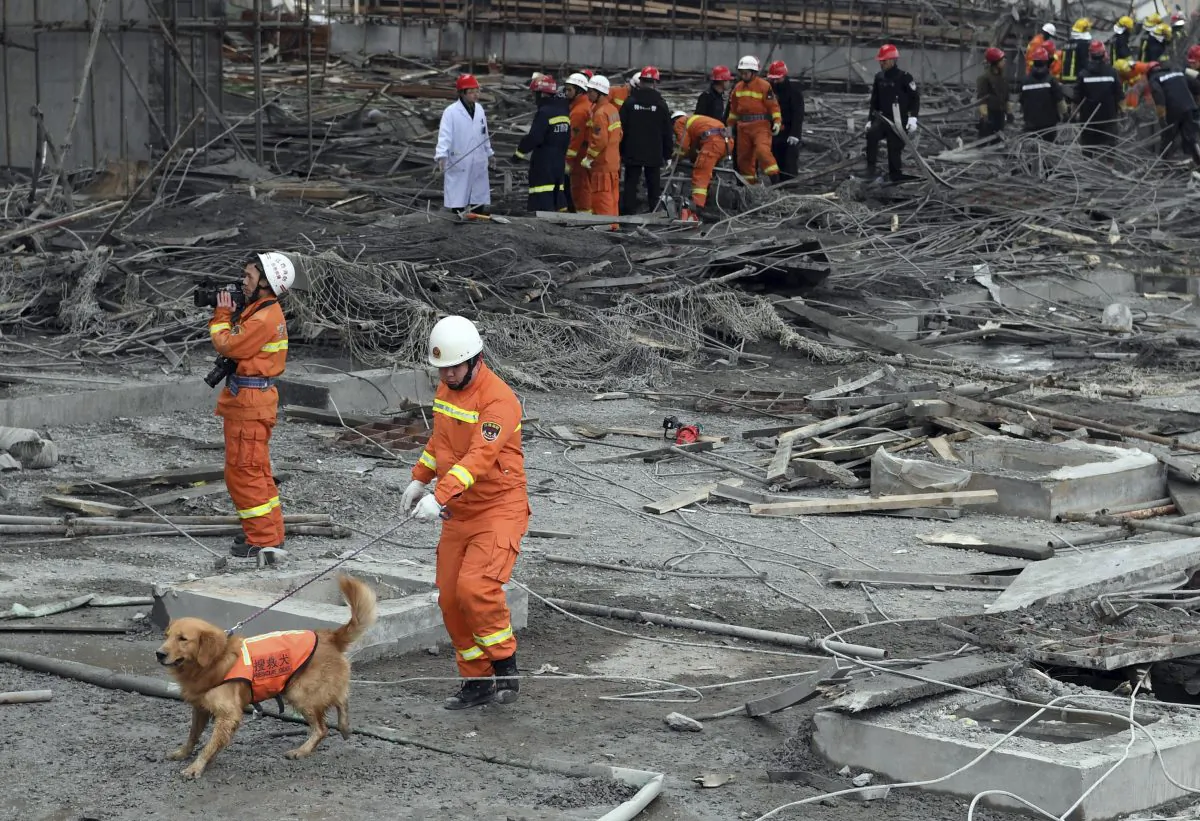 Rescue workers look for survivors after a work platform collapsed at the Fengcheng power plant in eastern China's Jiangxi Province on Nov. 24, 2016. (Wan Xiang/Xinhua via AP)