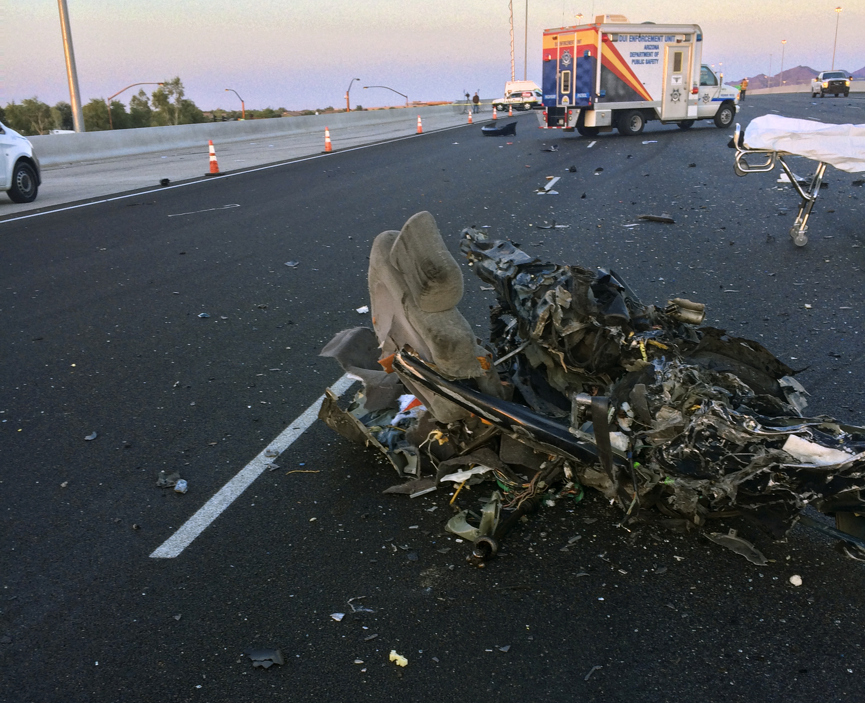 Debris from a car that hit a Greyhound bus head-on on Interstate 10 in a Phoenix suburb, on Nov. 25, 2016. (Arizona Department of Public Safety via AP)