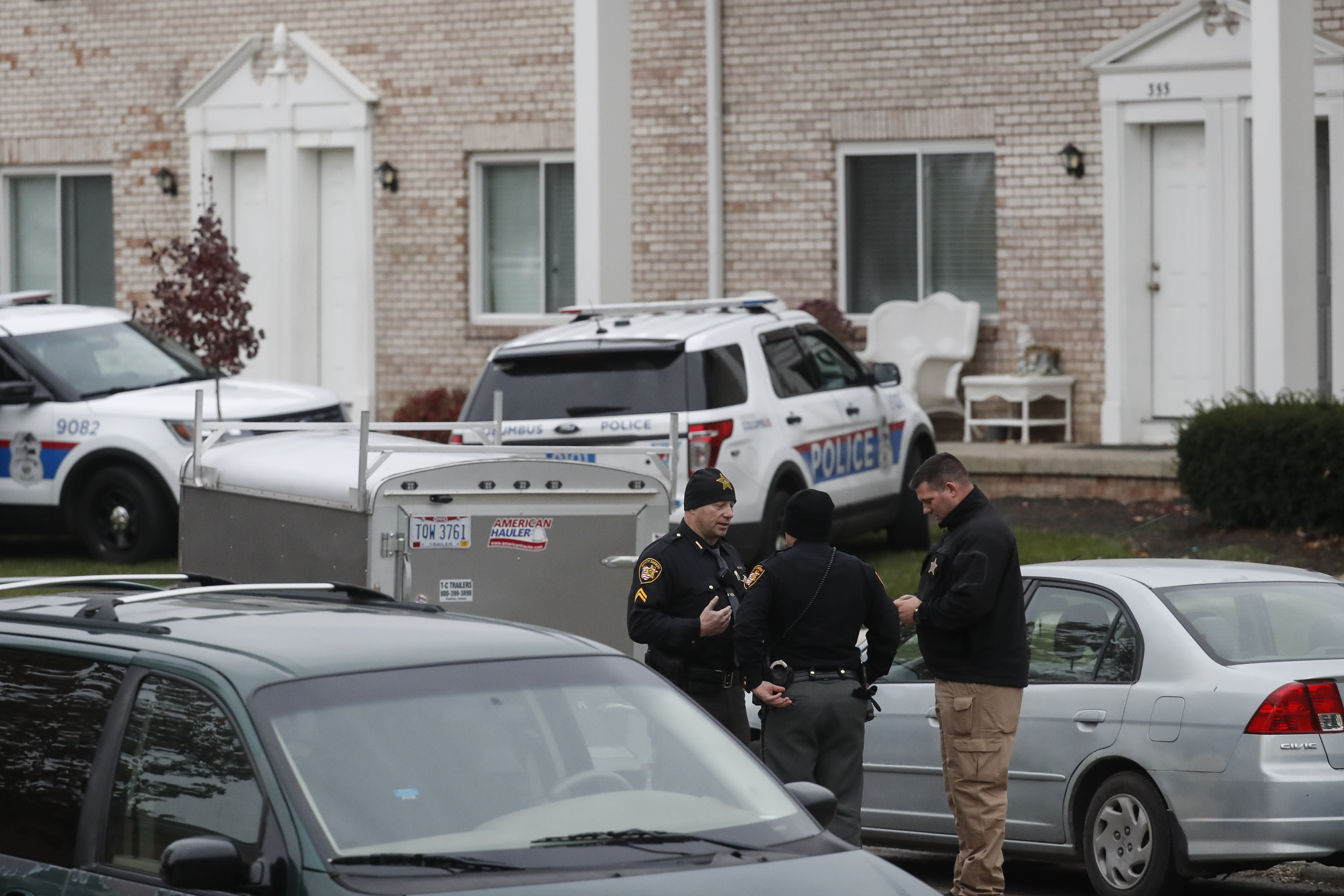 Police stand guard outside a residence of interest during their investigation into an earlier attack at The Ohio State University campus in Columbus, Ohio, on Nov. 28, 2016. (AP Photo/John Minchillo)