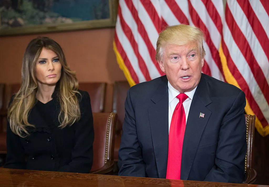 Melania Trump listens to her husband US President-elect Donald Trump speak to the press at the US Capitol in Washington, DC, on November 10, 2016. (NICHOLAS KAMM/AFP/Getty Images)