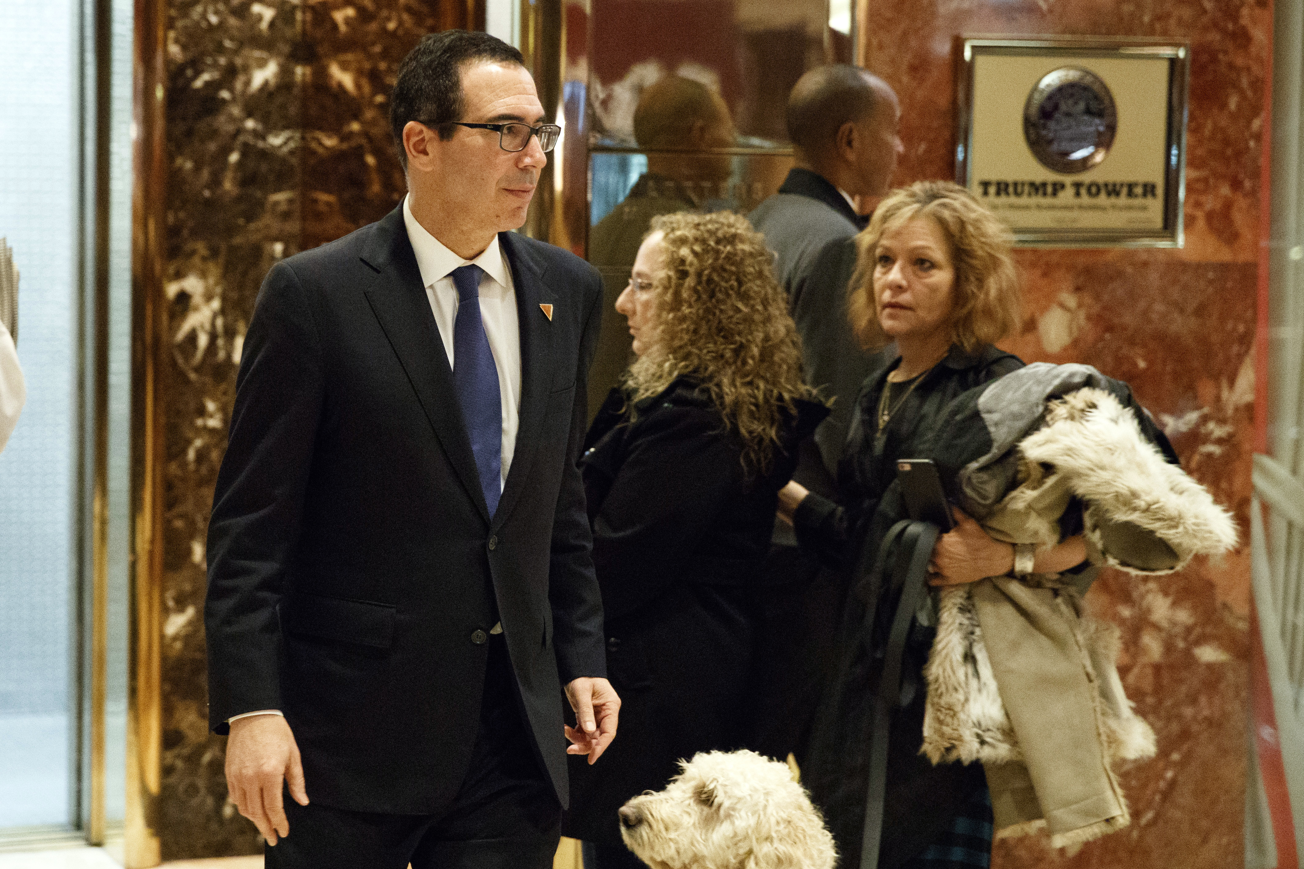 Steven Mnuchin, national finance chairman of President-elect Donald Trump's campaign, walks to lunch at Trump Tower in New York on Nov. 29, 2016. (AP Photo/Evan Vucci)