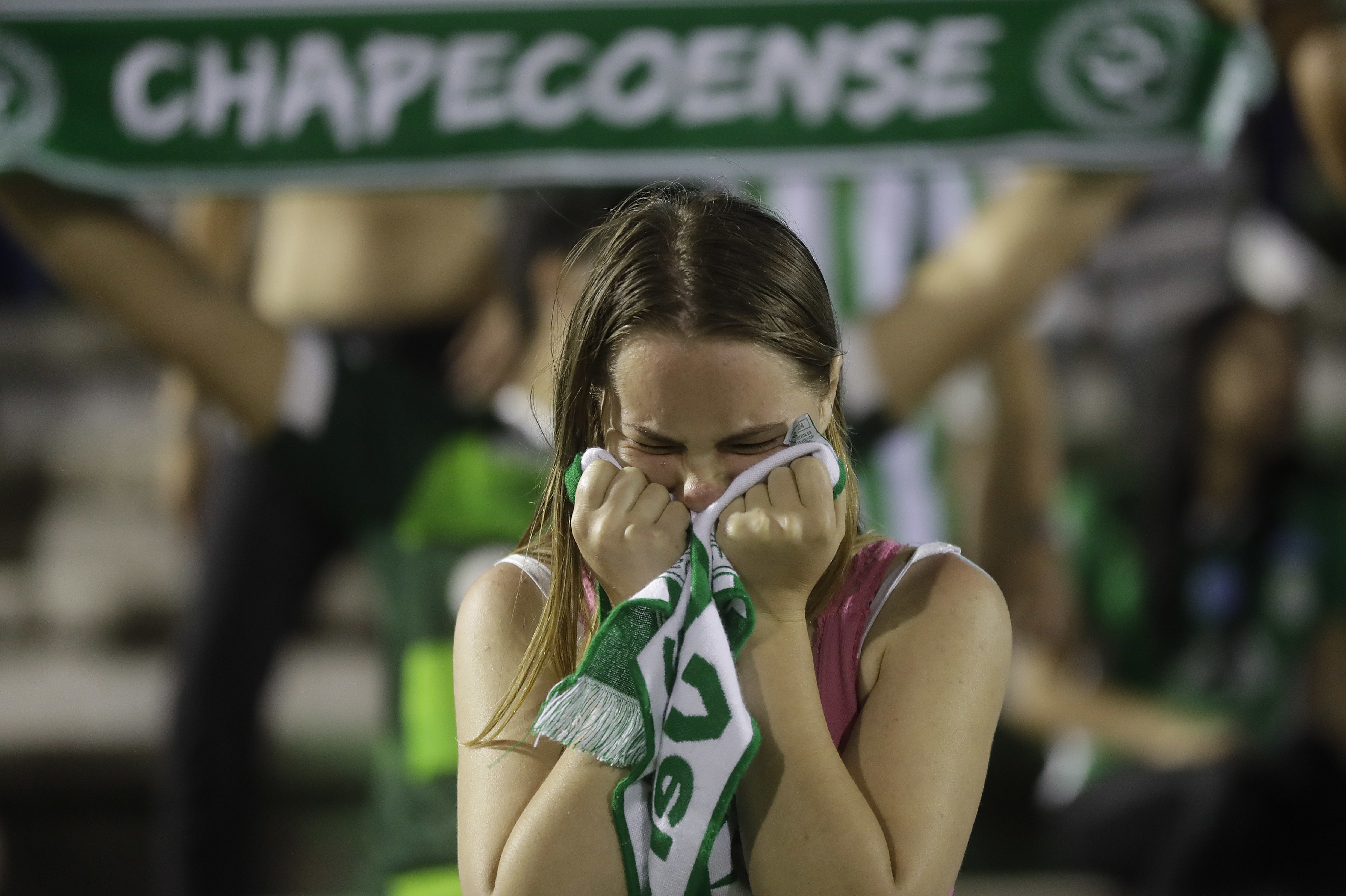 A fan of Brazil's soccer team Chapecoense mourns during a gathering inside Arena Conda stadium in Chapeco, Brazil, on Nov. 29, 2016. (AP Photo/Andre Penner)