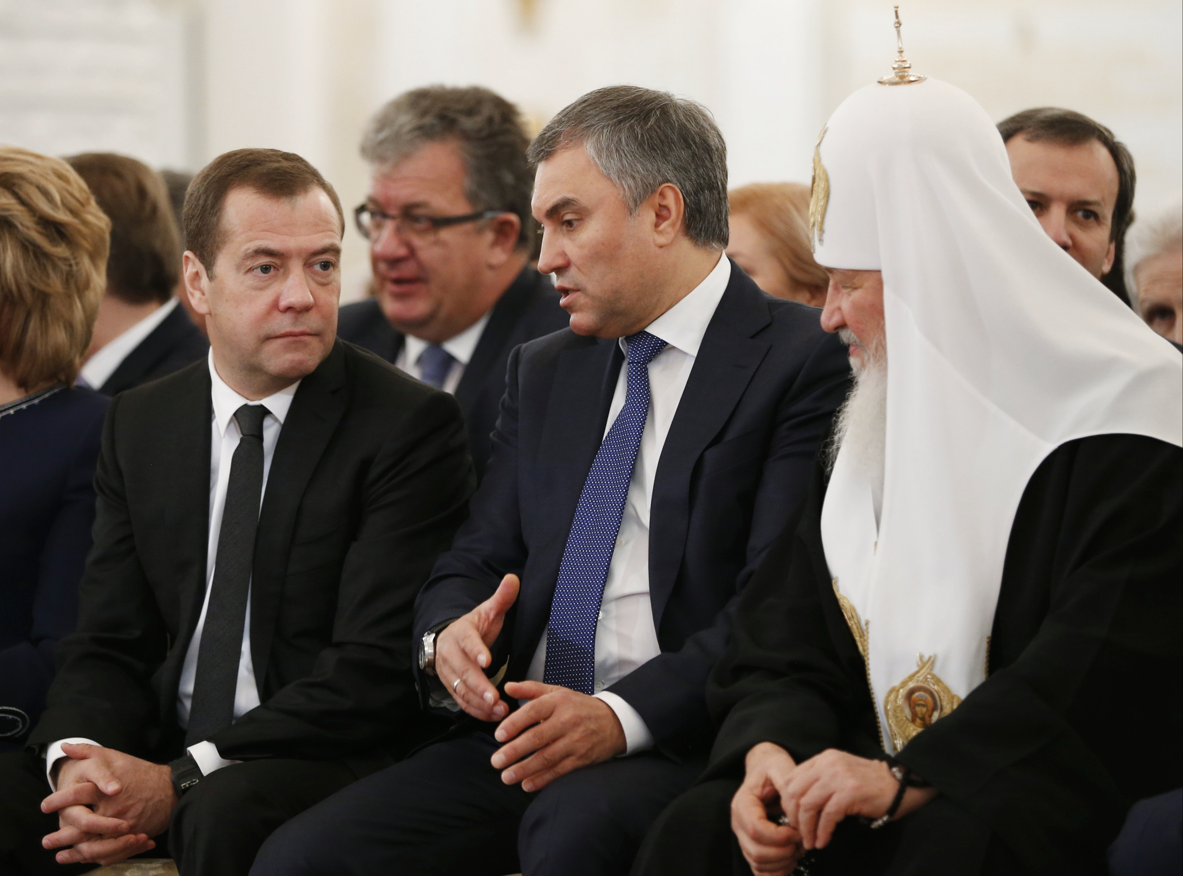Russian Prime Minister Dmitry Medvedev (L) and Orthodox Church Patriarch Krill (R) listen to parliament speaker Vyacheslav Volodin, center, prior President Vladimir Putin annual state of the nation address in the Kremlin in Moscow, Russia on Dec. 1, 2016. (Dmitry Astakhov/ Sputnik, Government Press Service Pool photo via AP )