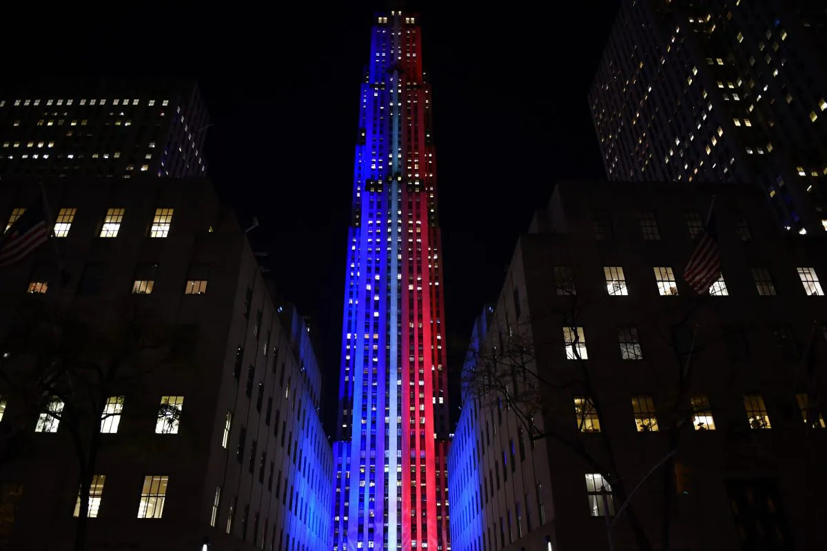 Rockefeller Center and Rockefeller Plaza is lit up in red and blue to mark the electoral progress of Hillary Clinton and Donald Trump on Nov. 7, 2016 as part of NBC's election night coverage. (TIMOTHY A. CLARY/AFP/Getty Images)