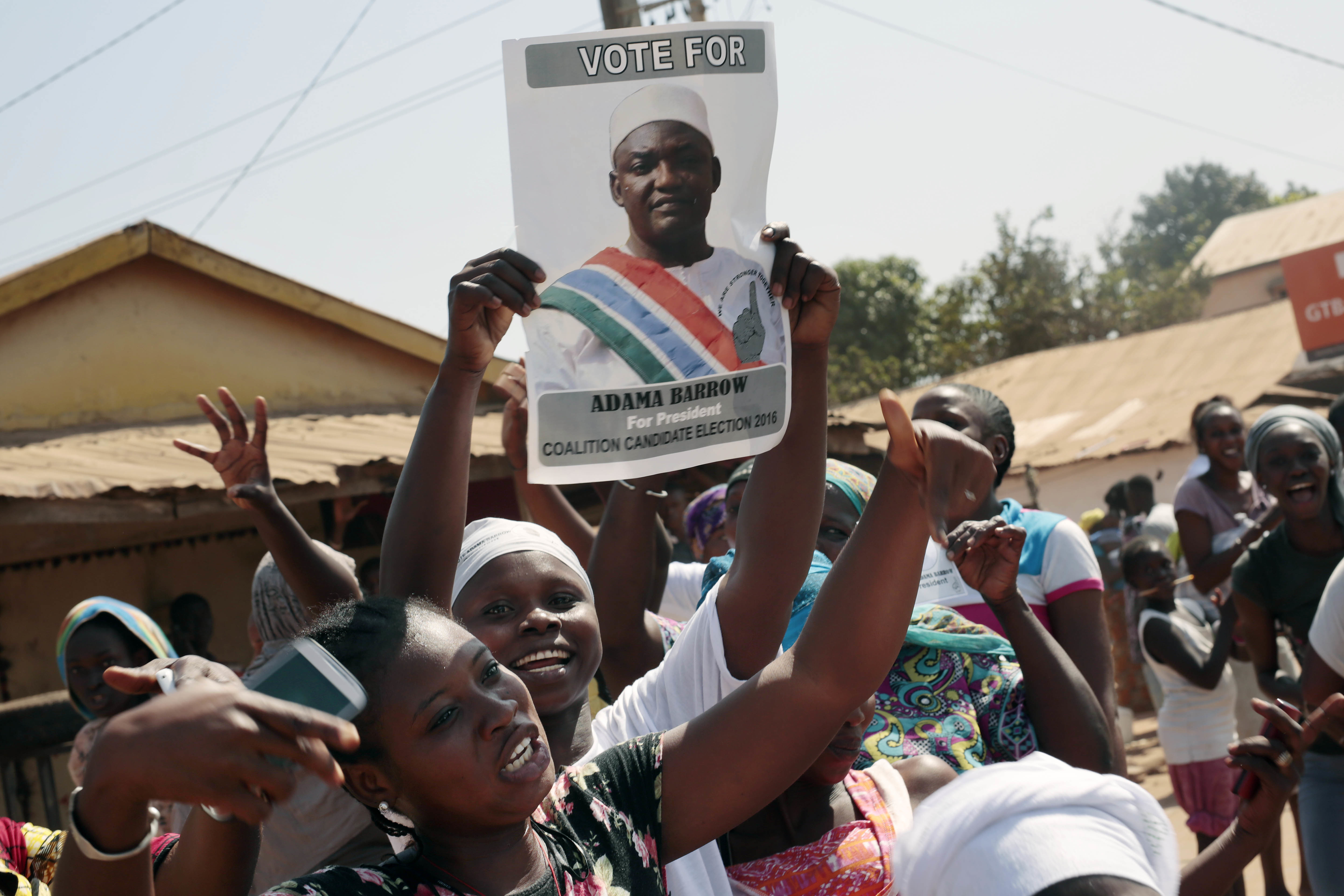 Gambians celebrate the victory of opposition coalition candidate Adama Barrow against longtime President Yahya Jammeh in the streets of Serrekunda, Gambia, on Dec. 2, 2016. (AP Photo/Jerome Delay)