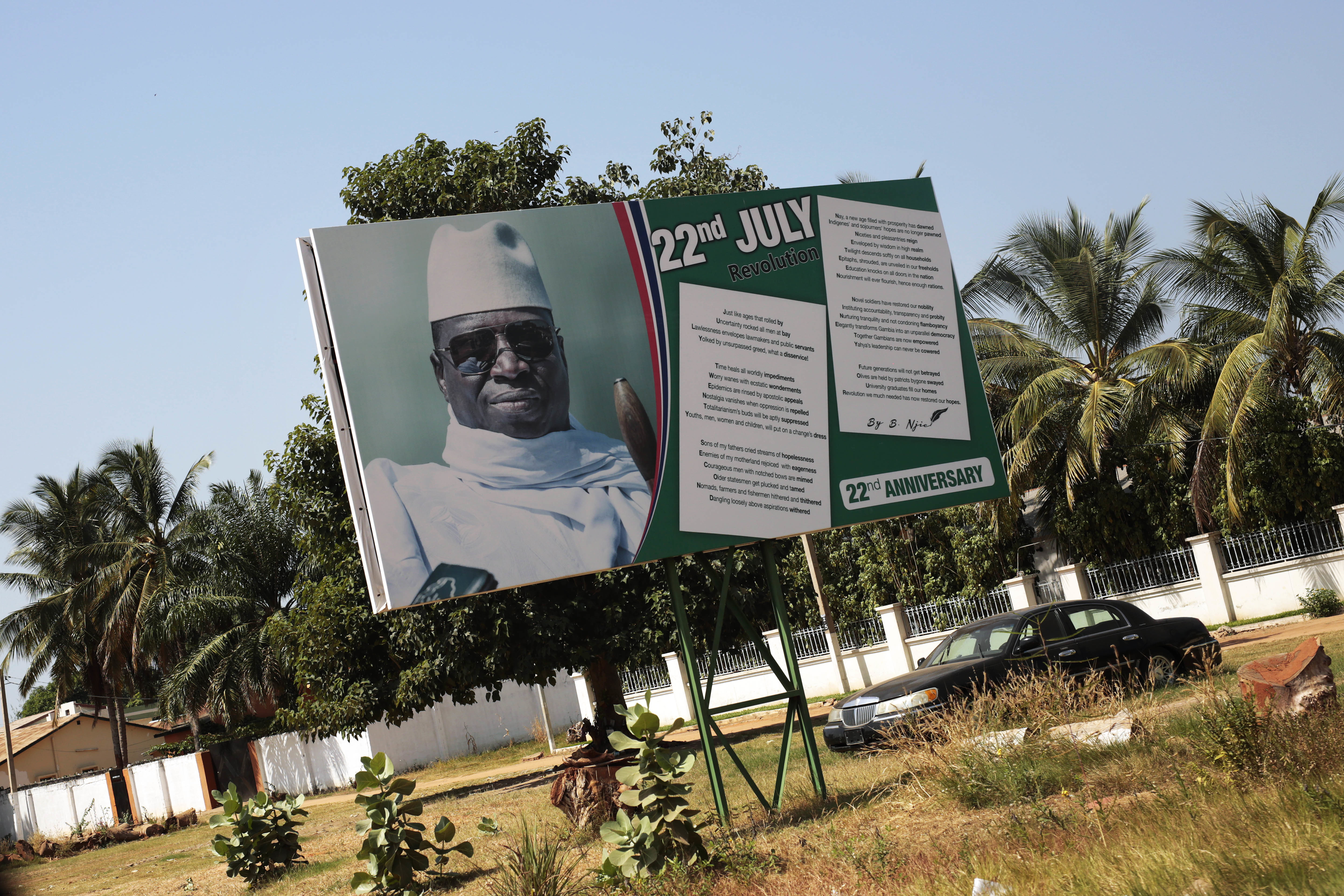 A poster showing longtime Gambian president President Yahya Jammeh along the street in Serrekunda, Gambia, on Dec. 2, 2016. (AP Photo/Jerome Delay)