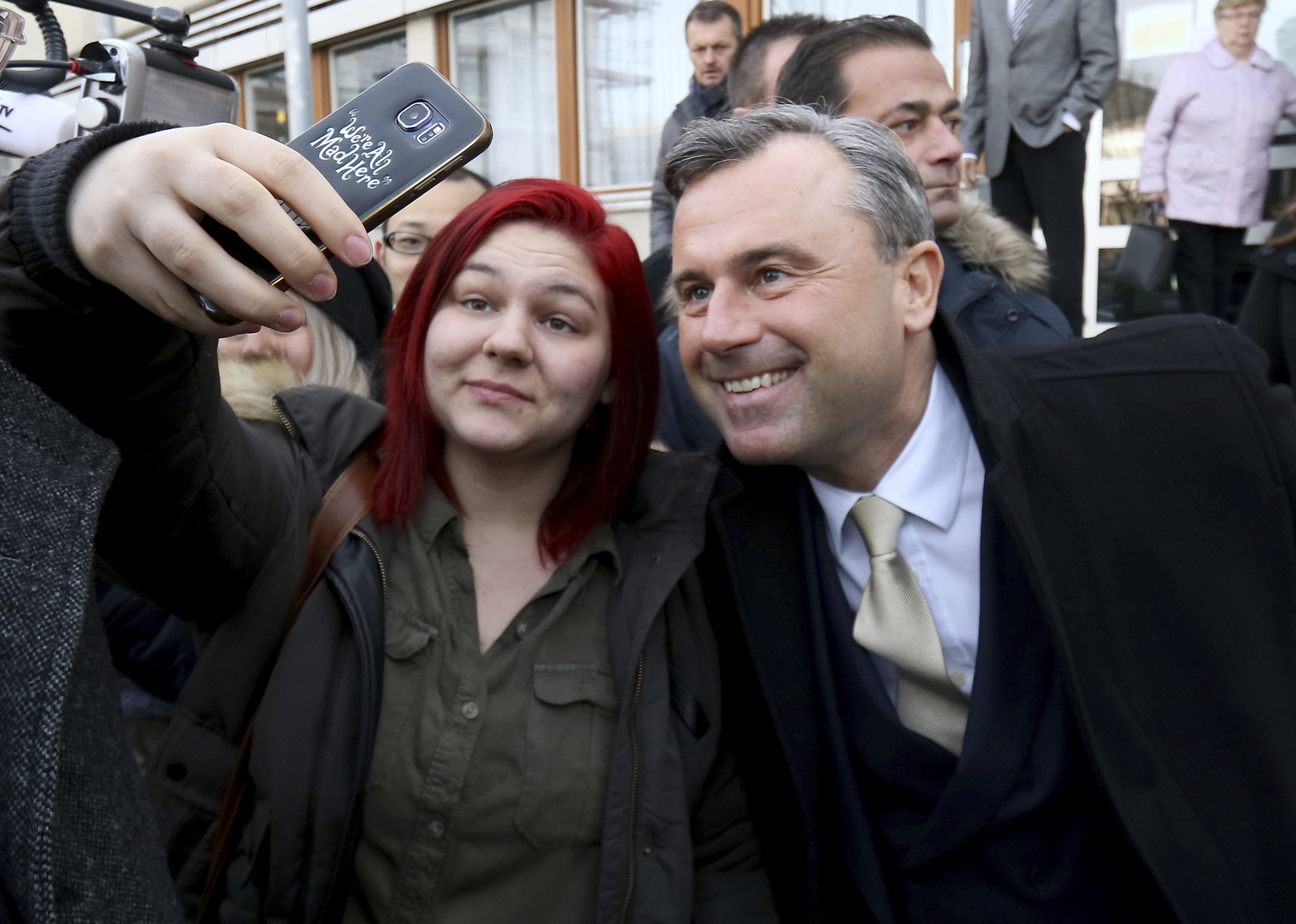 Norbert Hofer of Austria's Freedom Party, FPOE, takes pictures during the Austrian presidential elections, in Pinkafeld, Austria, on Dec. 4, 2016. (AP Photo/Ronald Zak)