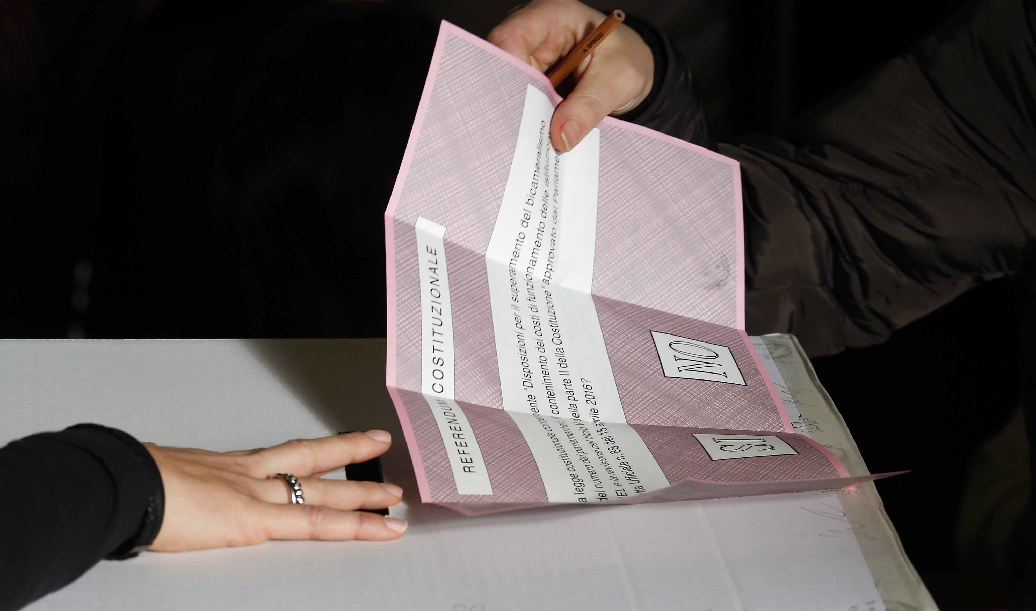 A ballot is being cast at a polling station in Pontassieve, Italy, on Dec. 4, 2016. (AP Photo/Antonio Calanni)