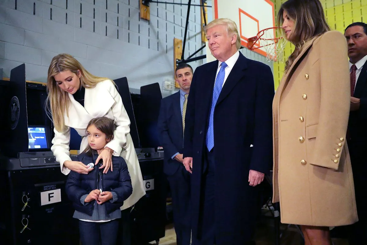 Donald Trump is joined by his wife Melania Trump (R), daughter Ivanka Trump (L) who places an 'I voted' sticker on her daughter Arabella Rose Kushner after they vote on Election Day at PS 59 in New York City on Nov. 8, 2016. (Chip Somodevilla/Getty Images)
