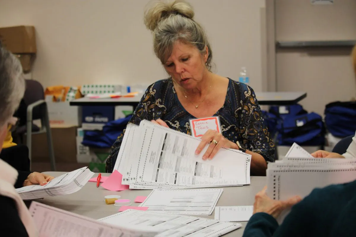 Connie Tews counts ballots in Kenosha, Wisconsin, at the request of Green Party candidate Jill Stein on Dec. 2, 2016.
The recount is being undertaken even though the results are unlikely to change the outcome. (VNEWS INTERNATIONAL LLC/AFP/Getty Images)