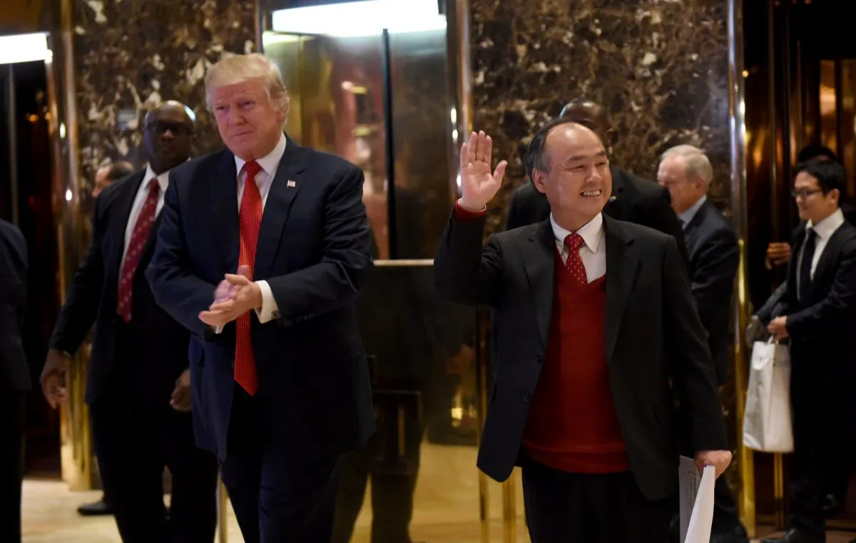 President-elect Donald Trump stands with SoftBank Group Corp. founder and Chief Executive Officer Masayoshi Son in the lobby of Trump Tower in New York on Dec. 6, 2016. (TIMOTHY A. CLARY/AFP/Getty Images)