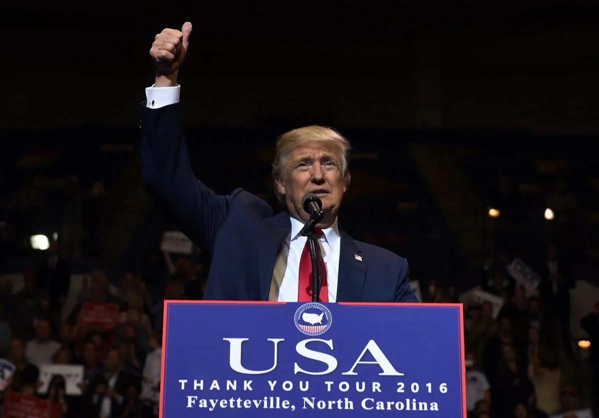US President-elect Donald Trump speaks at the Crown Coliseum in Fayetteville, North Carolina on December 6, 2016 during his USA Thank You Tour. / AFP / TIMOTHY A. CLARY (Photo credit should read TIMOTHY A. CLARY/AFP/Getty Images)