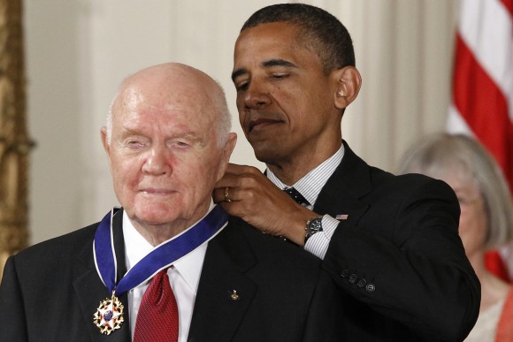 In this Tuesday, May 29, 2012, file photo, President Barack Obama awards the Medal of Freedom to former astronaut John Glenn during a ceremony in the East Room of the White House in Washington. Glenn, the first American to orbit Earth who later spent 24 years representing Ohio in the Senate, died Thursday, Dec. 8, 2016, at the age of 95. (AP Photo/Charles Dharapak, File)