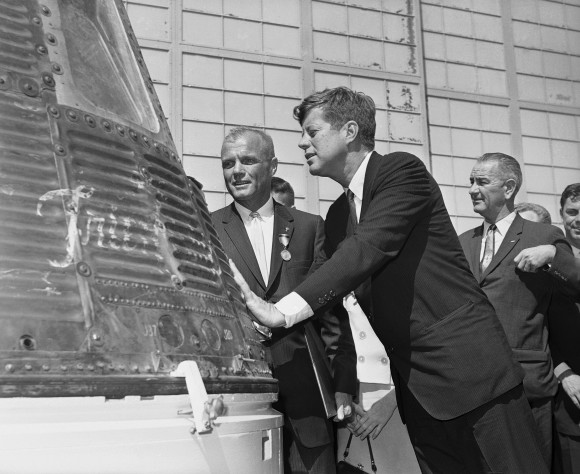 In this Feb. 23, 1962 file photo, astronaut John Glenn and President John F. Kennedy inspect the Friendship 7, the Mercury capsule in which Glenn became the first American to orbit the Earth. Kennedy presented Distinguished Service medal to Glenn at Cape Canaveral, Fla. At right is Vice President Lyndon Johnson. Glenn, who later spent 24 years representing Ohio in the Senate, has died at 95. (AP Photo/Vincent P. Connolly, File)