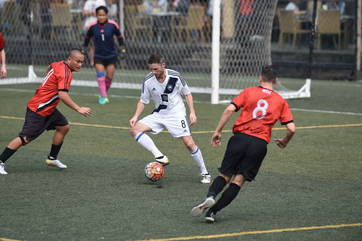 Club Albion on the attack in a one-sided Yau Yee League match against Colloids FC, Sports Road on Sunday Dec 4, 2016. Albion ran out winners 11-0. (Bill Cox/Epoch Times)