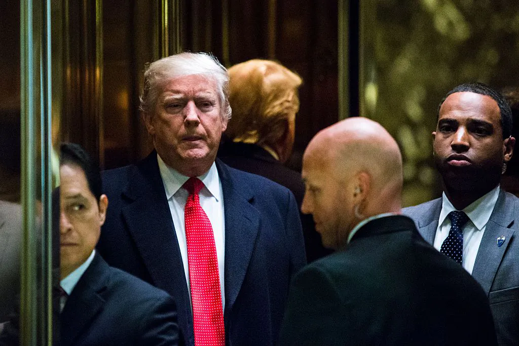 US President-elect Donald Trump returns to elevators after speaking to the media at Trump Tower in New York on Dec. 6, 2016. (EDUARDO MUNOZ ALVAREZ/AFP/Getty Images)