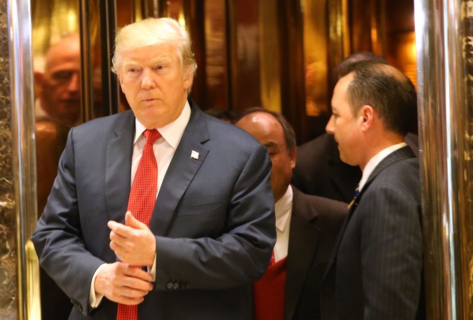 President-elect Donald Trump walks out of an elevator speak to the media at Trump Tower in New York City on Dec. 6, 2016. (Spencer Platt/Getty Images)