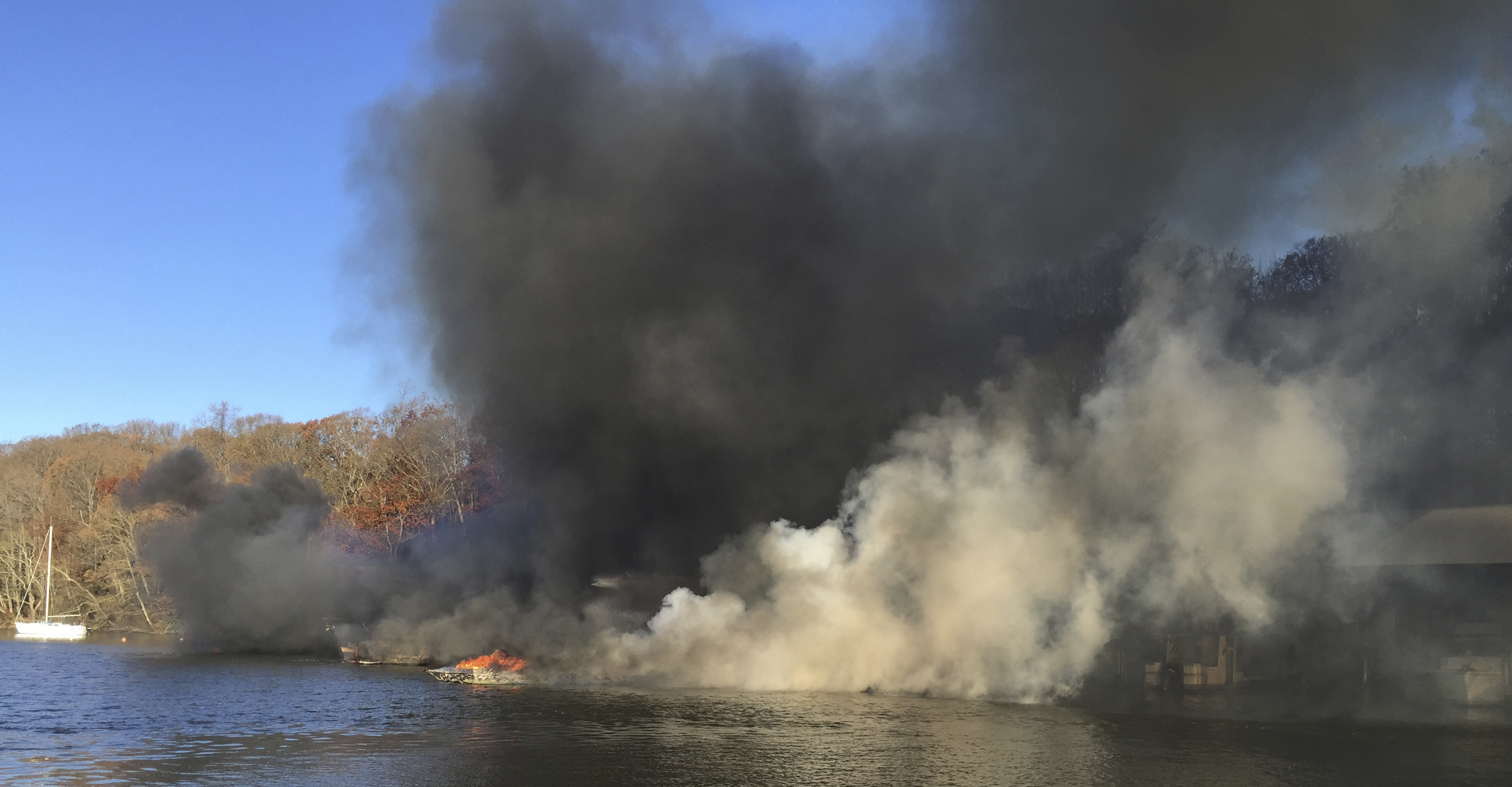 A burning marina on the James River in Richmond, Va., on Dec. 9, 2016. (Mike Ostrander via AP)