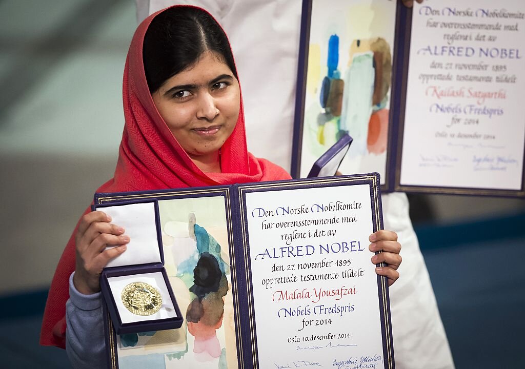 Nobel Peace Prize laureate Malala Yousafzai displays her medal and diploma during the Nobel Peace Prize awards ceremony at the City Hall in Oslo, Norway, on December 10, 2014. (Odd Andersen/AFP/Getty Images)