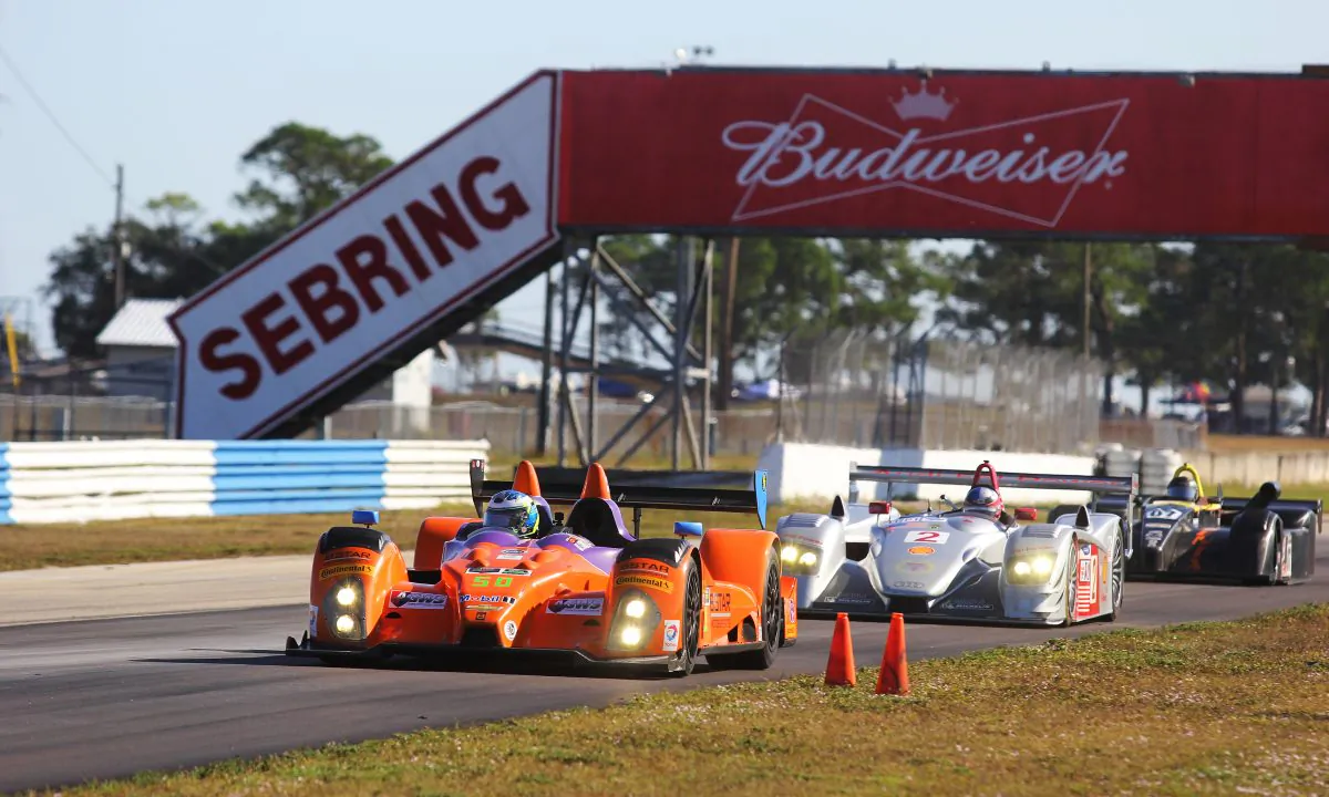 Group E prototypes race under the Budweiser bridge towards Turn Seven during the HSR Classic 12 Hour at Sebring, Dec. 3, 2016. (Chris Jasurek/Epoch Times)