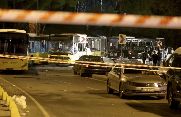 Police investigators work at the scene of explosions next to the Besiktas football club stadium, in Istanbul, on Dec. 10, 2016. (AP Photo) TURKEY OUT