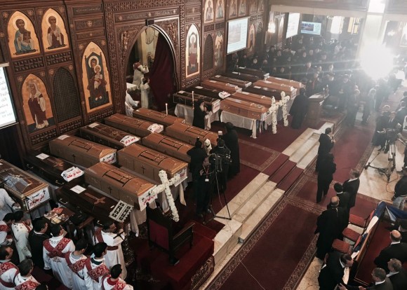 Coffins are laid out during a funeral service for victims of a Sunday cathedral bombing, at the Virgin Mary Church, in Cairo, Egypt, on Dec. 12, 2016. (AP Photo/Nariman El-Mofty)